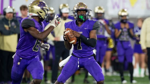 Hueytown's Earl Woods (1) looks to pass during the Class 6A football state championship at Protective Stadium in Birmingham, Ala., on Friday, Dec. 3, 2021. Clay-Chalkville leads Hueytown 22-14 at halftime.